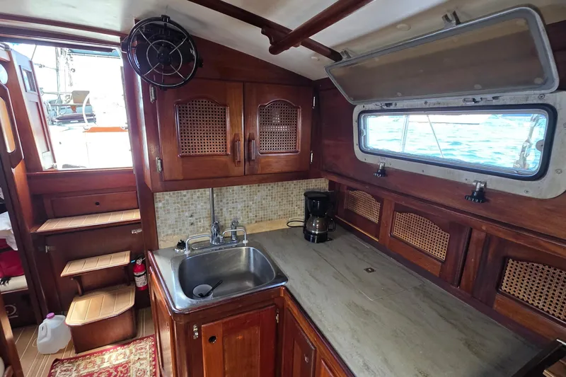 Slide: The Image of Interior of 1987 Gozzard 36 Cruiser with wooden cabinetry and nautical decor. - 47