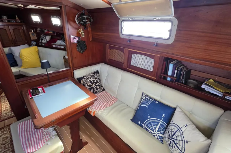 Slide: The Image of Interior of 1987 Gozzard 36 Cruiser with cozy seating and nautical decor. - 56