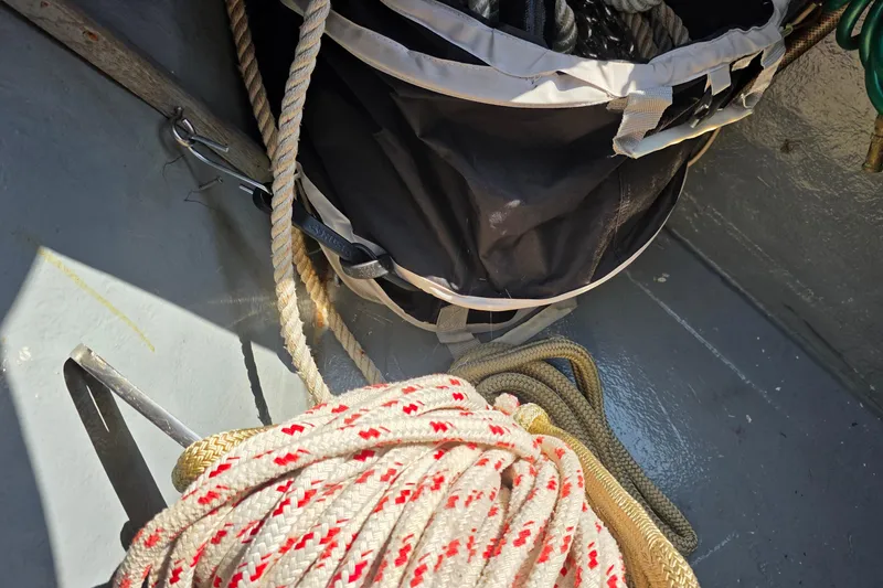 Slide: The Image of Coiled ropes and gear on 1987 Gozzard 36 Cruiser deck. - 9