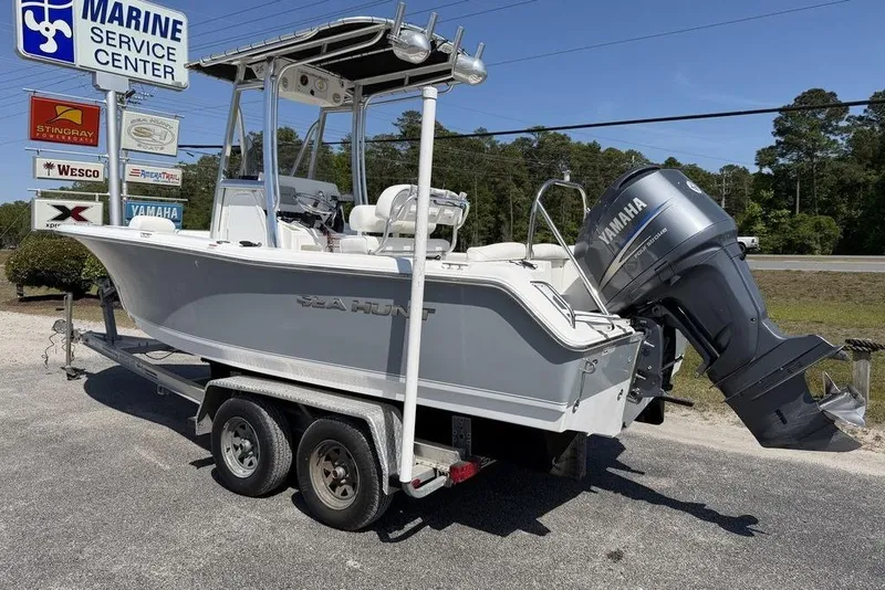 Slide: The Image of 2015 Sea Hunt Ultra 211 boat on trailer at marine service center. - 2