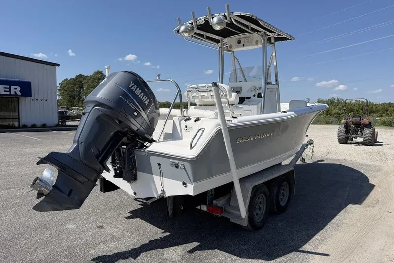 Slide: The Image of 2015 Sea Hunt Ultra 211 boat with Yamaha outboard motor on a trailer. - 4