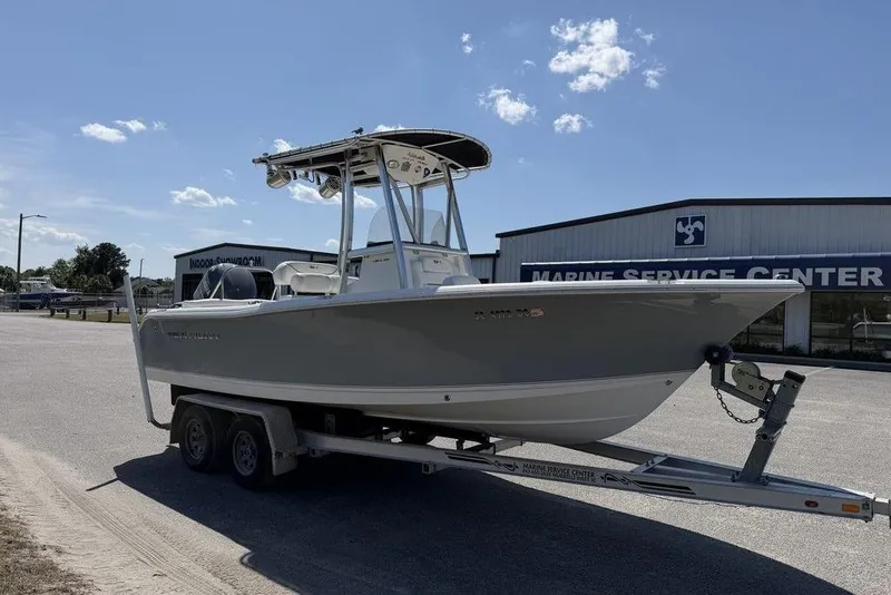 Slide: The Image of 2015 Sea Hunt Ultra 211 boat on trailer at marine service center. - 5