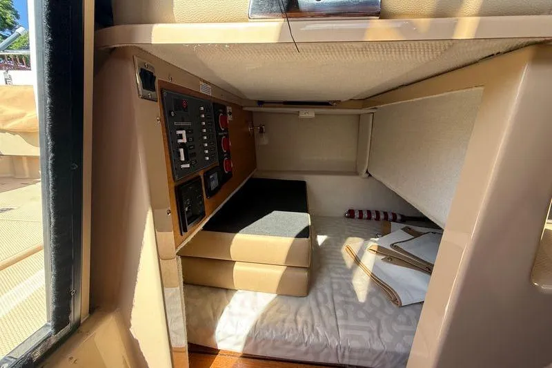 Slide: The Image of 2019 Ranger Tugs R-23 cabin interior with control panel and seating area. - 11