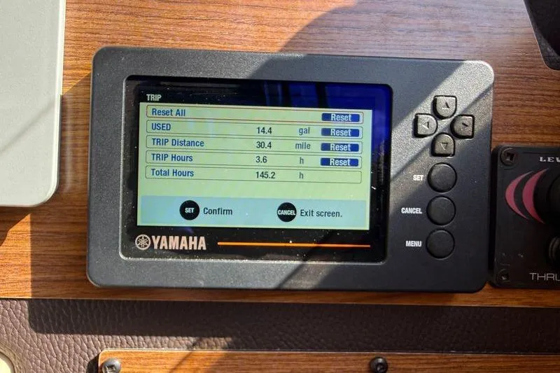 Slide: The Image of Yamaha display on 2019 Ranger Tugs R-23 showing trip data: fuel, distance, hours. - 14