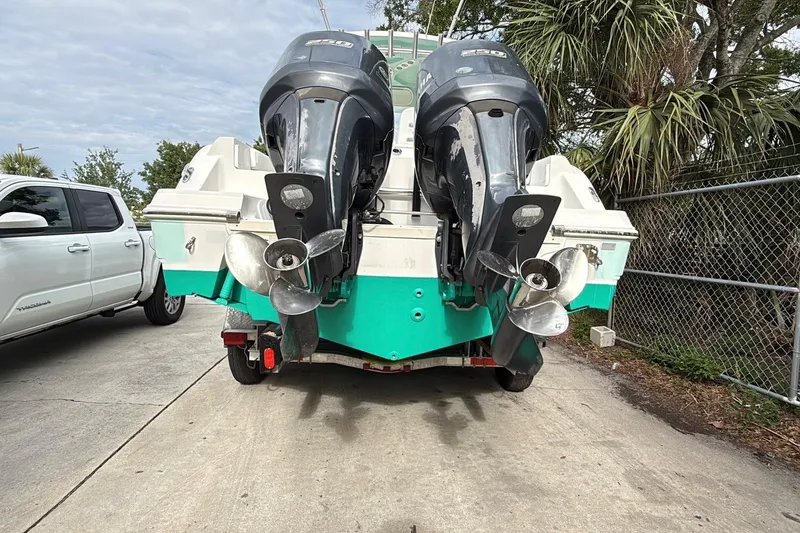 Slide: The Image of 2013 Sea Fox 286 Center Console boat with dual outboard motors on a trailer. - 3