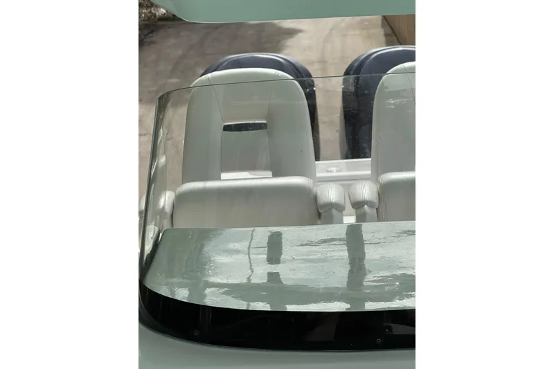 Slide: The Image of 2013 Sea Fox 286 Center Console boat interior with dual seats and windshield. - 7