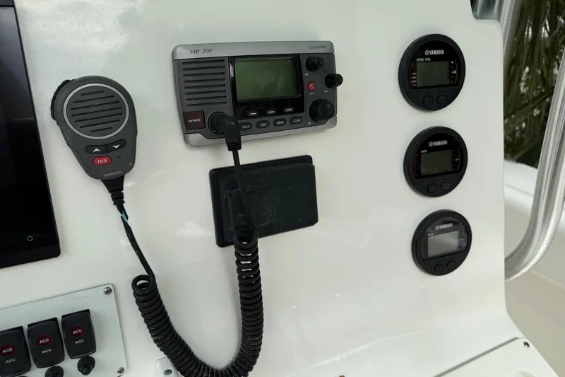 Slide: The Image of Control panel of a 2013 Sea Fox 286 Center Console with Garmin VHF radio and Yamaha gauges. - 9