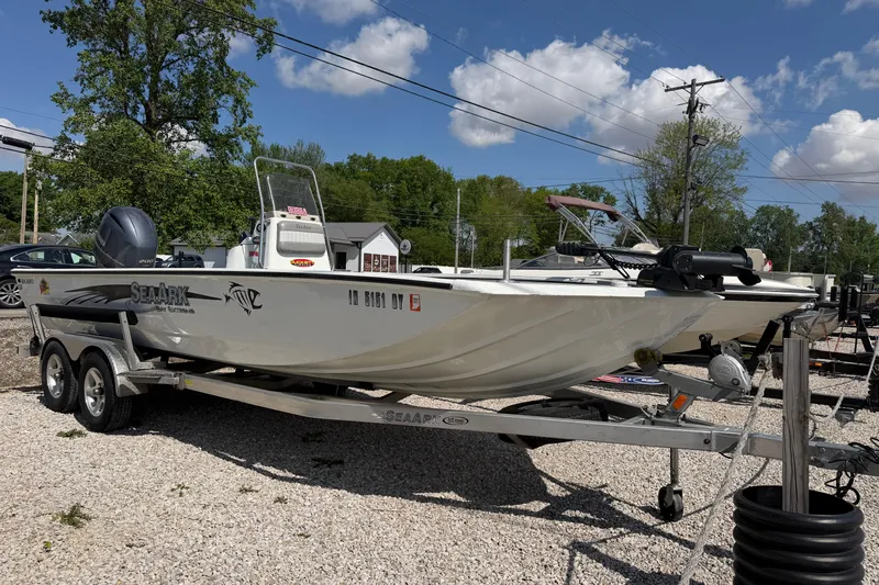 The Image of 2017 SeaArk BX220 boat on trailer under clear blue sky. - 0
