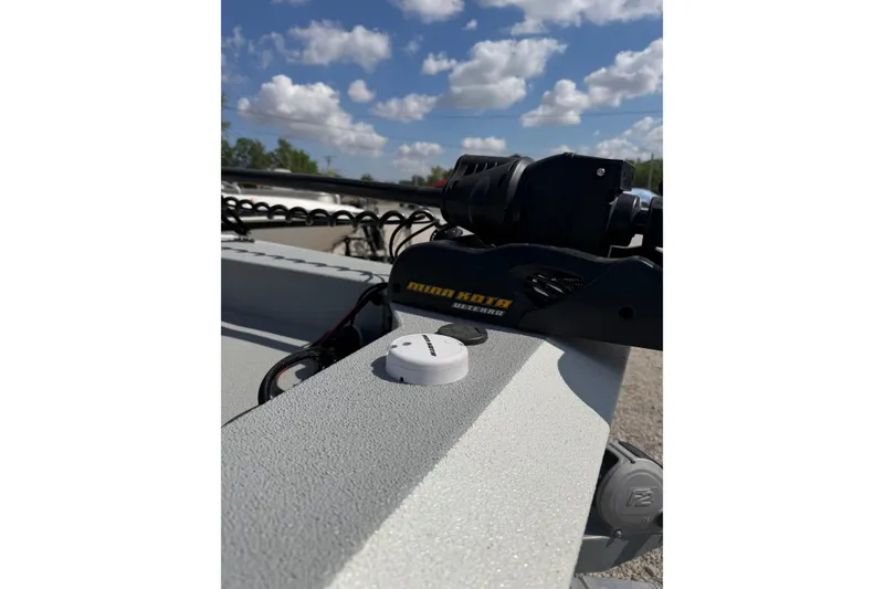 Slide: The Image of 2017 SeaArk BX220 boat with Minn Kota trolling motor under a cloudy sky. - 3