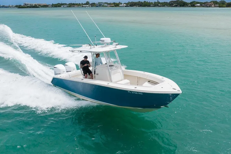 The Image of 2011 Jupiter 26 FS boat cruising on turquoise water. - 0