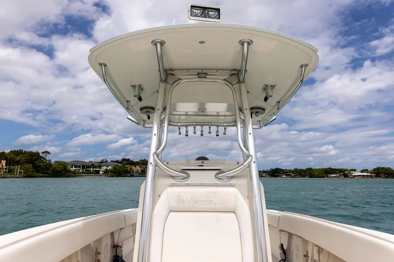 Slide: The Image of 2011 Jupiter 26 FS boat on water under cloudy sky. - 10