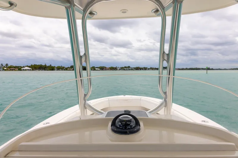 Slide: The Image of Front view from a 2011 Jupiter 26 FS boat on calm waters. - 17