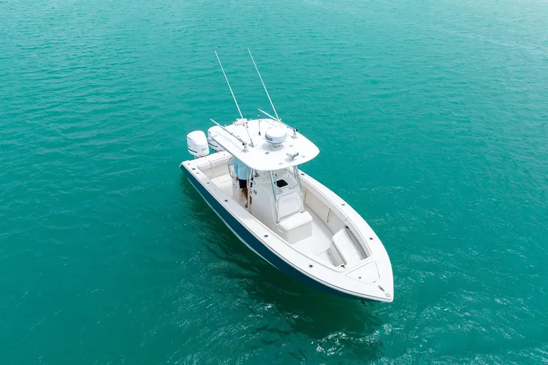 Slide: The Image of 2011 Jupiter 26 FS boat on clear turquoise water. - 28