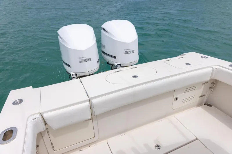 Slide: The Image of 2011 Jupiter 26 FS boat with twin Yamaha 250 engines on calm water. - 5