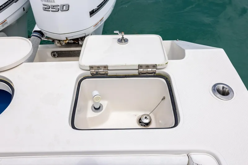 Slide: The Image of Open hatch on 2011 Jupiter 26 FS boat with Yamaha 250 engine visible. - 7