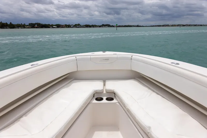 Slide: The Image of Bow view of 2011 Jupiter 26 FS boat on calm waters under cloudy skies. - 9