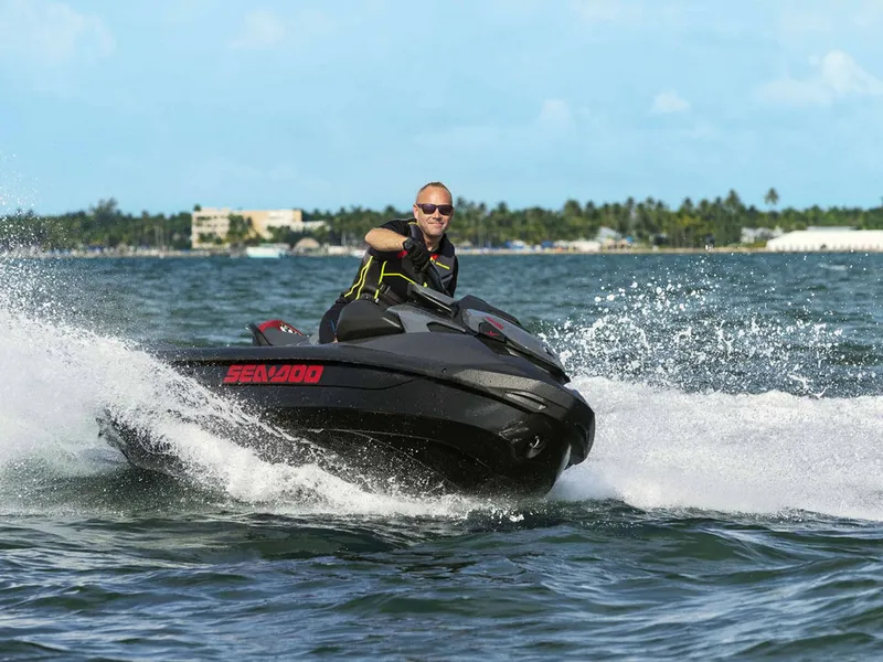 Slide: The Image of Man riding 2024 Sea-Doo GTR-X 300 on the water. - 8