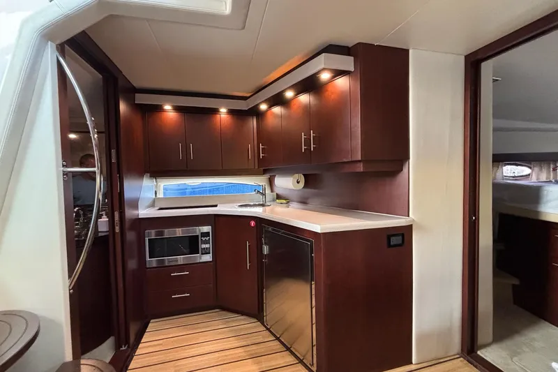 Slide: The Image of Luxurious kitchen interior of 2015 Regal 42 Sport Coupe yacht with modern amenities. - 16