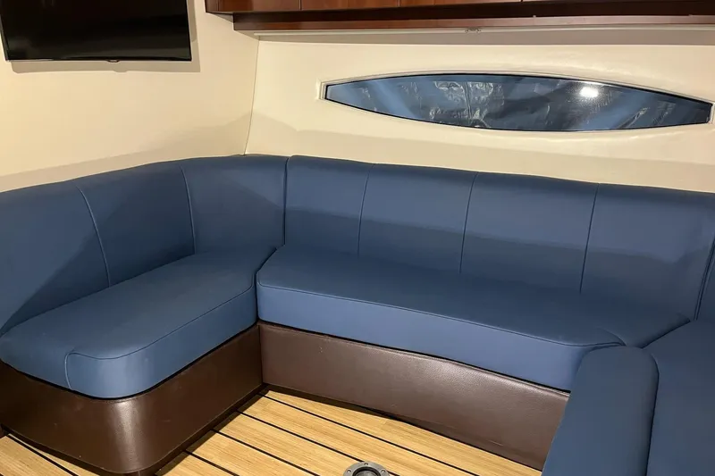 Slide: The Image of Luxurious blue seating in 2015 Regal 42 Sport Coupe yacht interior. - 18