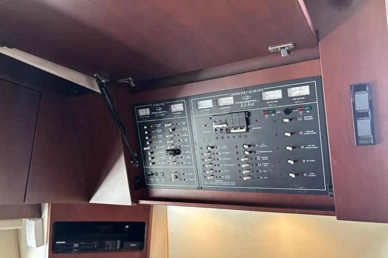 Slide: The Image of Electrical control panel inside a 2015 Regal 42 Sport Coupe yacht. - 20
