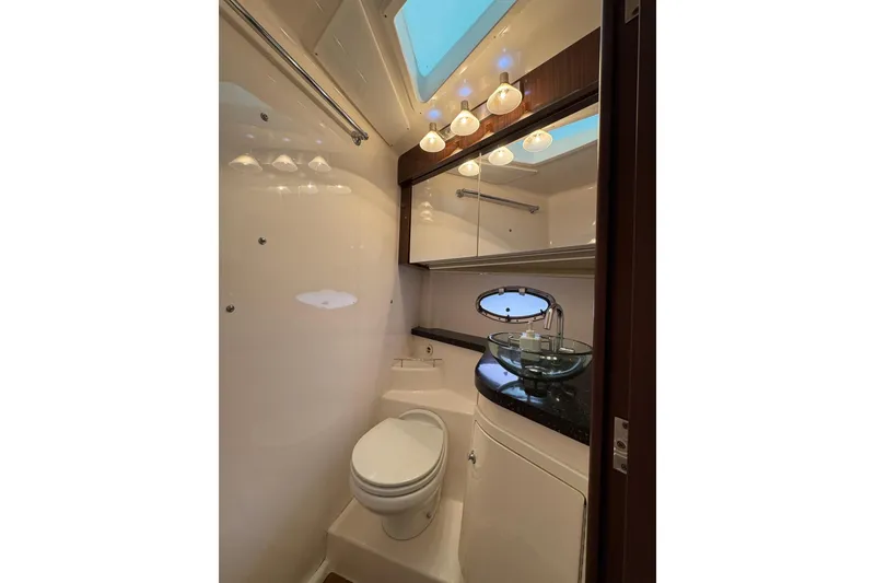 Slide: The Image of Luxurious bathroom in 2015 Regal 42 Sport Coupe yacht with modern fixtures. - 25