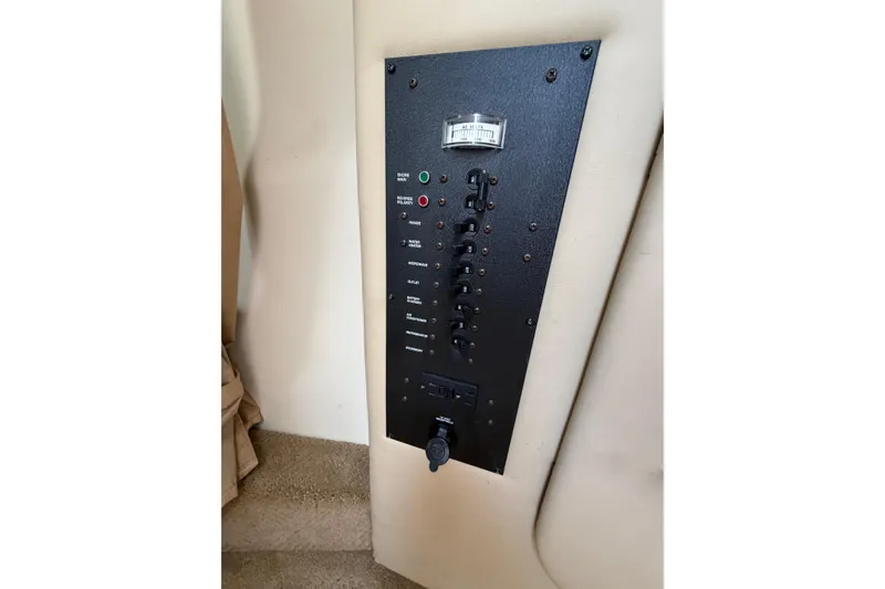 Slide: The Image of Control panel of a 2006 Rinker 250 Express Cruiser boat interior. - 17