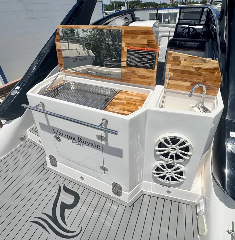 Slide: The Image of L'acqua Royale LR280 GRAN CABRIO 2024 with stylish deck and grill area. - 11