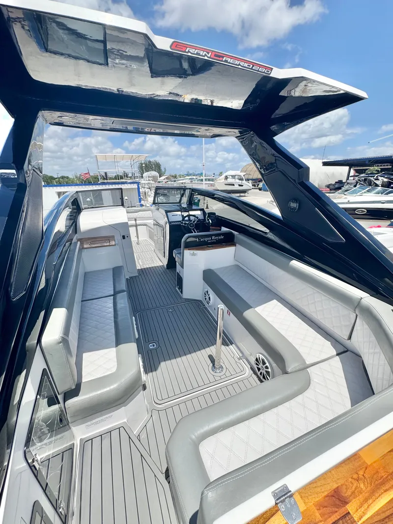 Slide: The Image of Luxurious L'acqua Royale LR280 Gran Cabrio boat, 2024 model, featuring elegant interior. - 13