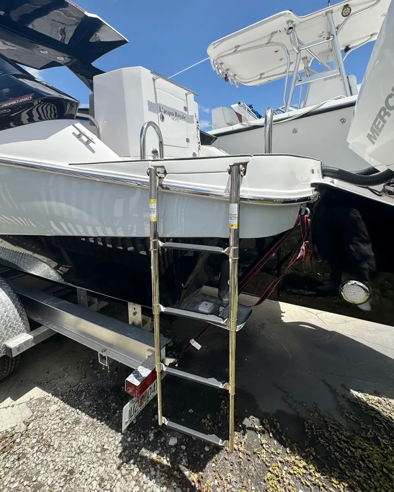 Slide: The Image of 2024 L'acqua Royale LR280 GRAN CABRIO boat with ladder on trailer. - 7