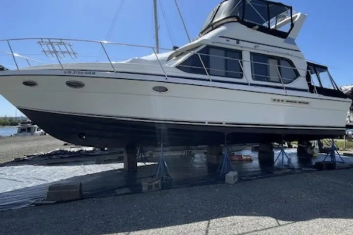 Slide: The Image of A large white boat on dry dock under clear blue skies. - 2