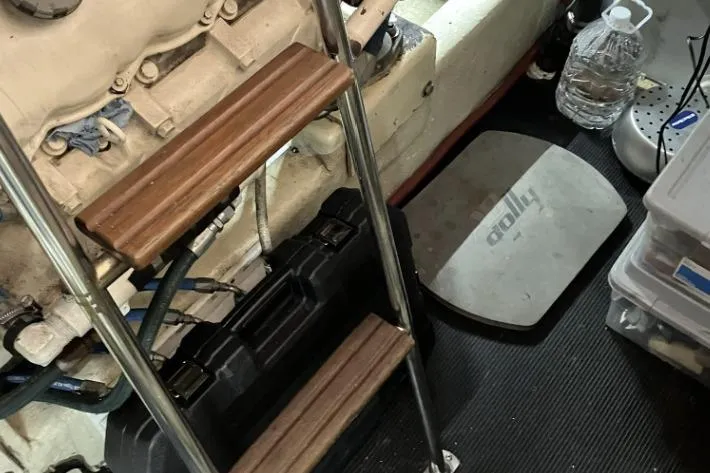 Slide: The Image of Engine room with ladder, tools, and equipment in a 1990 Cooper Prowler Sedan. - 22