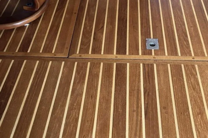 Slide: The Image of Wooden floor with striped pattern, featuring a metal latch and part of a chair. - 34