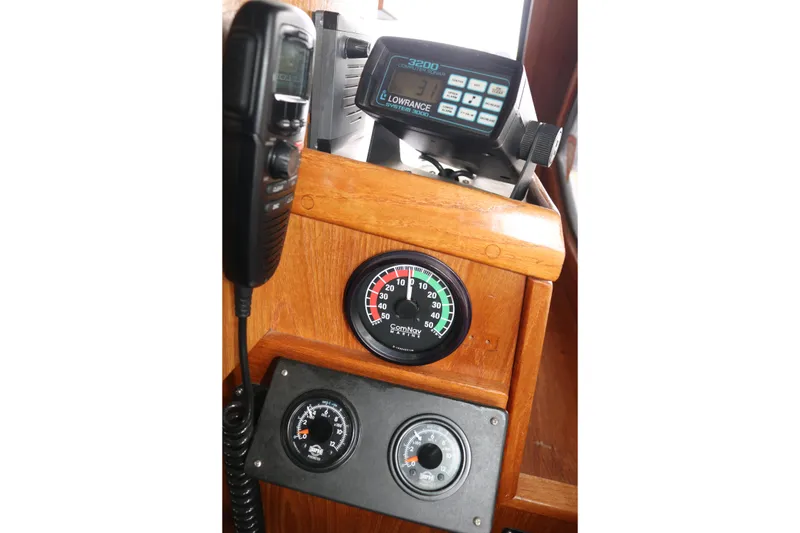 Slide: The Image of Control panel with gauges and radio in a 1990 Cooper Prowler Sedan. - 39