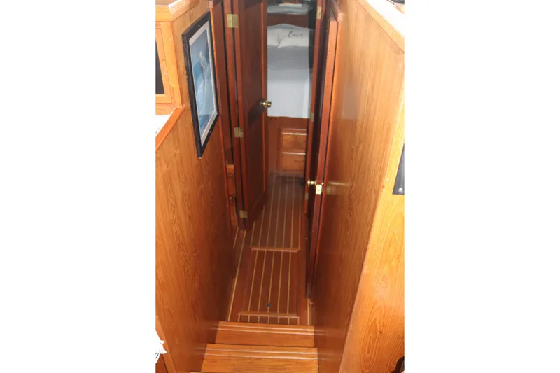Slide: The Image of Wood-paneled interior hallway of a 1990 Cooper Prowler Sedan. - 59