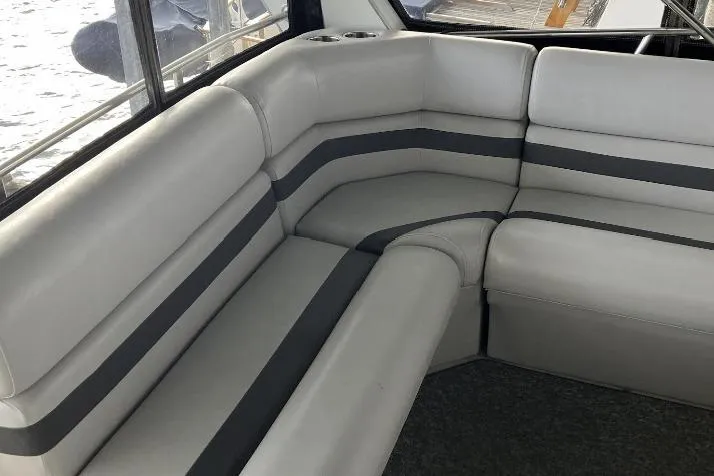 Slide: The Image of Cozy bedroom with blue bedding, "love" pillows, and wooden accents in a Cooper Prowler Sedan. - 60