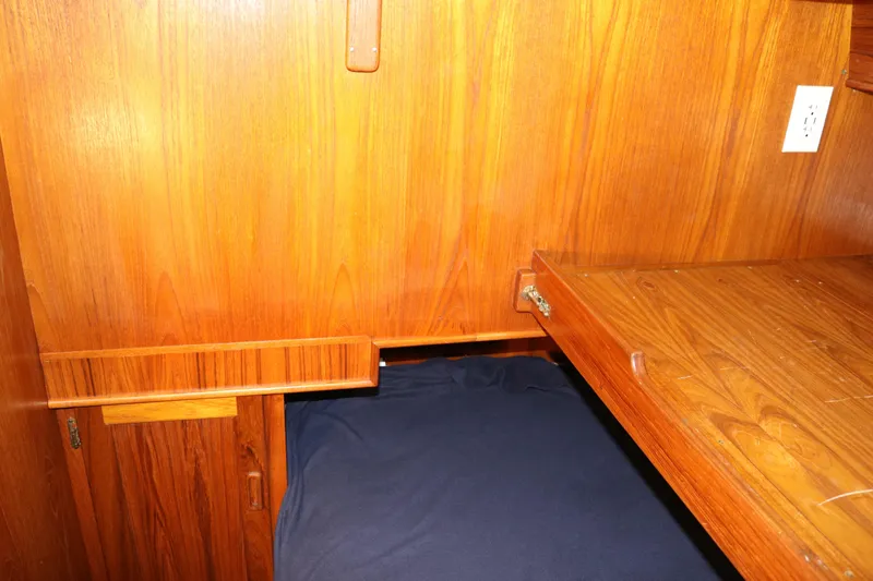 Slide: The Image of Wooden interior of a 1990 Cooper Prowler Sedan with a foldable table and bed. - 62