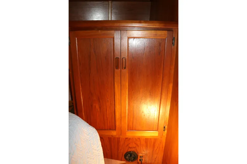 Slide: The Image of Wooden cabinet inside a 1990 Cooper Prowler Sedan, showcasing classic interior design. - 64