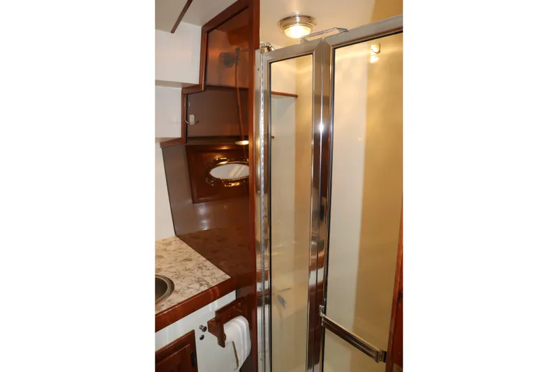 Slide: The Image of 1990 Cooper Prowler Sedan interior with shower and wooden cabinetry. - 66