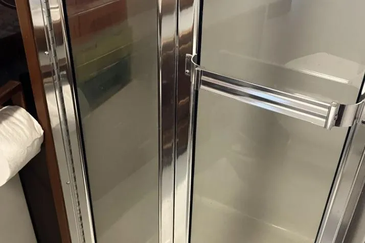 Slide: The Image of A shiny metal door with a handle, possibly part of a vehicle interior. - 67