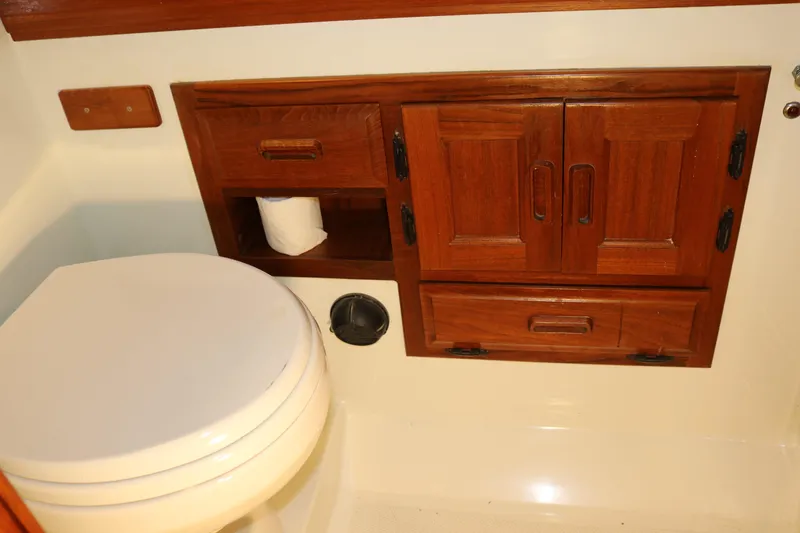 Slide: The Image of Compact bathroom with wooden cabinets in a 1990 Cooper Prowler Sedan. - 69