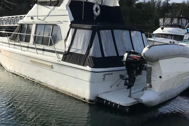 Slide: The Image of A Cooper Prowler boat docked with a Mercury outboard motor attached. - 7