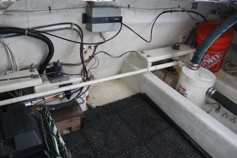 Slide: The Image of Interior of a 1990 Cooper Prowler Sedan showing mechanical components and wiring. - 77