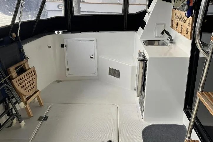 Slide: The Image of Interior of a modern boat with seating, sink, and storage area. - 8