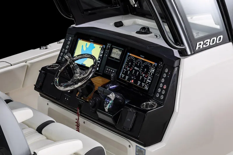 Slide: The Image of Manufacturer Provided Image: 2025 Robalo R300 Center Console dashboard with advanced navigation and control systems. - 6