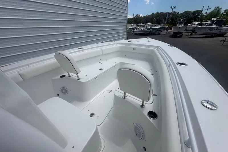 Slide: The Image of 2019 Sea Hunt Ultra 275 SE boat interior with white seating and storage compartments. - 4
