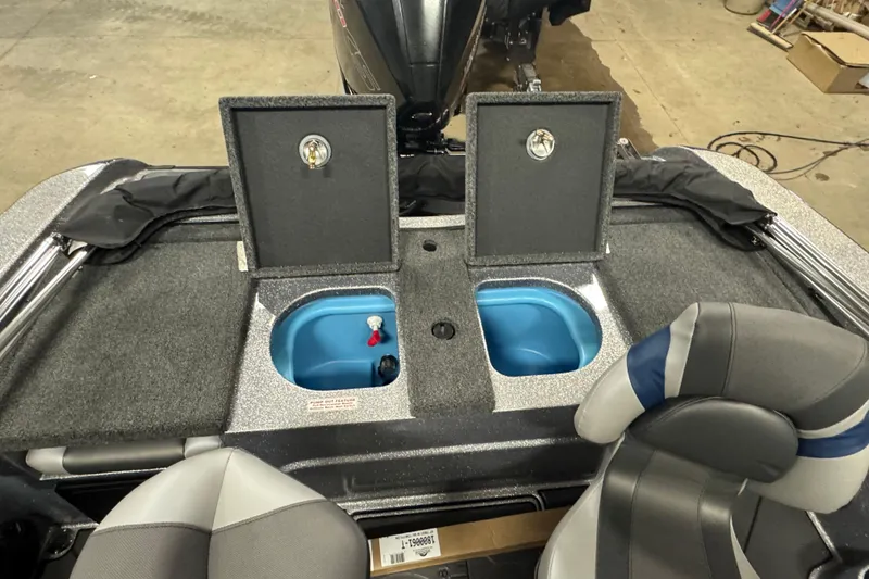 Slide: The Image of 2026 Nitro ZV19 Sport Pro boat interior with open storage compartments and seating. - 11