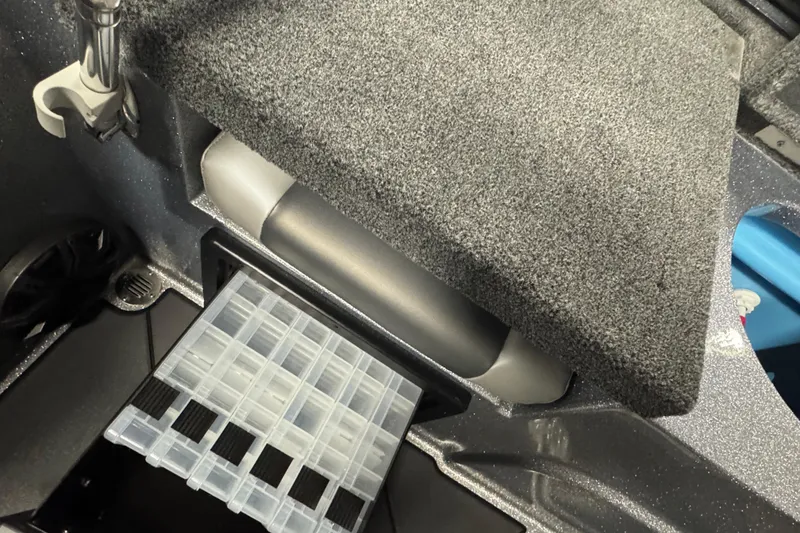 Slide: The Image of Interior storage compartment of 2026 Nitro ZV19 Sport Pro boat. - 12