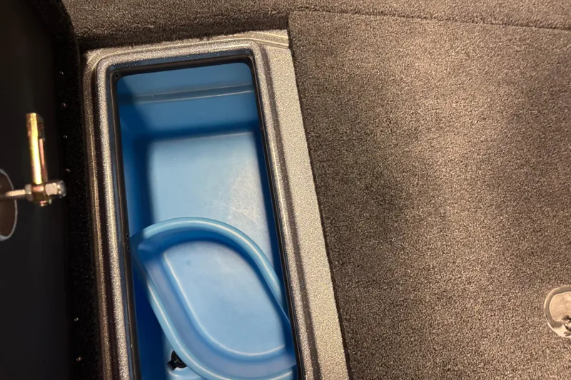 Slide: The Image of Storage compartment in 2026 Nitro ZV19 Sport Pro boat, featuring blue interior. - 19