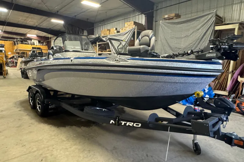 Slide: The Image of 2026 Nitro ZV19 Sport Pro boat in a warehouse setting. - 2