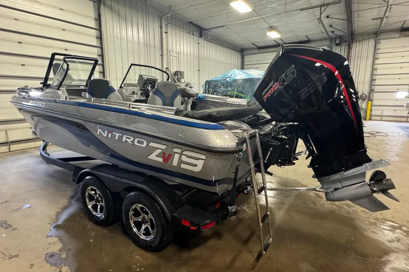 Slide: The Image of 2026 Nitro ZV19 Sport Pro boat in a garage, featuring a powerful outboard motor. - 4